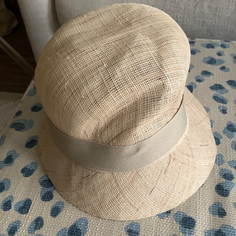 Straw hat with bow trim.